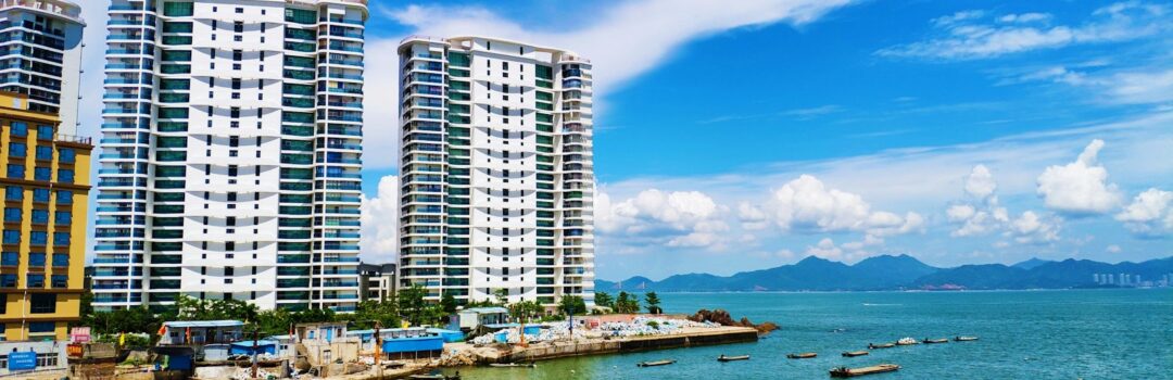 aerial photo of buildings beside sea